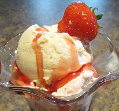 homemade vanilla ice cream with strawberry sauce