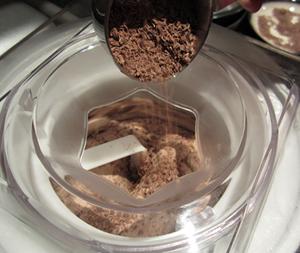 adding grated chocoloate to mix